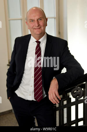 Potsdam, Germany. 11th Mar, 2019. Brandenburg's Prime Minister Dietmar Woidke (SPD) during an interview at his desk in his study at the Potsdam State Chancellery. Credit: Thomas Uhlemann/dpa-zentralbild/ZB/dpa/Alamy Live News Stock Photo