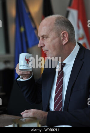 Potsdam, Germany. 11th Mar, 2019. Brandenburg's Prime Minister Dietmar Woidke (SPD) during an interview at his desk in his study at the Potsdam State Chancellery. Credit: Thomas Uhlemann/dpa-zentralbild/ZB/dpa/Alamy Live News Stock Photo