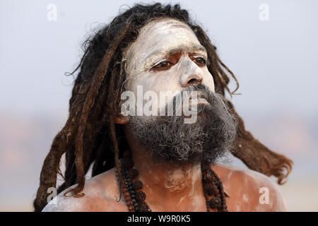 Sadhu (holy man) on the ghats of Ganges in Varanasi, India. Varanasi is the holiest of the seven sacred cities in India. Stock Photo