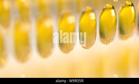 3d rendering Fish oil fish swimming through Capsule supplements healthy living omega 3 Stock Photo