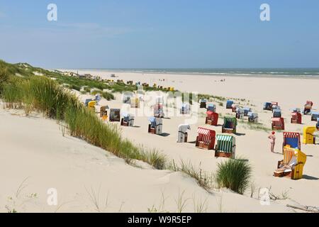 Sandy beach beach, bathing beach with beach chairs in the dunes, Juist, East Frisian Island, East Frisia, Lower Saxony, Germany Stock Photo
