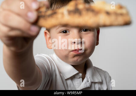 King Bread, called in German language Dreikönigskuchen, baked in Switzerland on January 6th. Small plastic miniature of the king is hidden inside of t Stock Photo