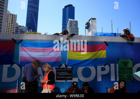 Construction workers watch on at 1 William Street during the Extinction Rebellion protest in the Brisbane Central District 6 August 2019. Stock Photo