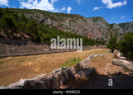 The ancient stadium at the top of the site at Delphi in Greece, where Pan hellenic sporting events were held in Ancient Greek times. Stock Photo