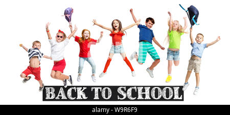 Group of elementary school kids or pupils jumping in colorful casual clothes jumping isolated on white studio background. Creative collage. Back to school, education, childhood concept. Stock Photo