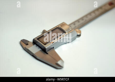 modern digital caliper on a light background, partial blur Stock Photo