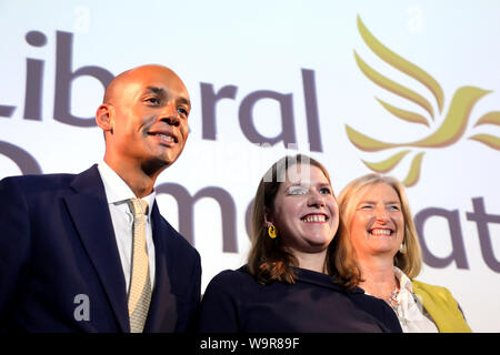 London / UK – August 15, 2019: Liberal Democrats leader Jo Swinson (C) poses with two recent recruits to her party, MPs Chuka Umunna (L) and Sarah Wollaston (R), after delivering a speech in central London Stock Photo