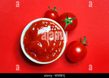 tomato ketchup and tomatoes Stock Photo