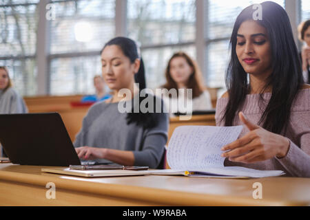 Multinational group of students in an auditorium Stock Photo
