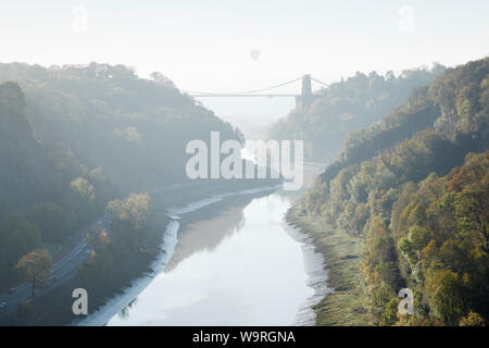 Avon Gorge and Clifton Suspension Bridge with Leigh Woods to the right and a hot air balloon in the distance. Bristol. UK. Stock Photo