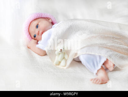 premature reborn doll beautiful blue eyes , selective focus , vertical image for copy space  and text Stock Photo