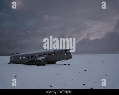Crashed plane on a snowy field. Photo from March in Iceland Stock Photo
