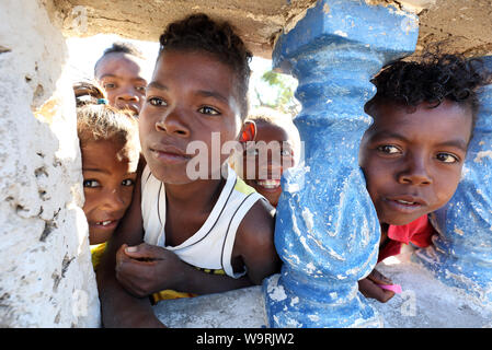 Children watch the celebration of the Independence Day in Anakao, Madagascar. Madagascar is among the poorest countries in the world Stock Photo