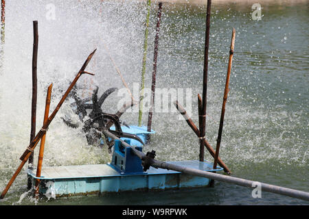 Oxygen generator is hitting the surface to create the bubbles for wastewater treatment. Stock Photo