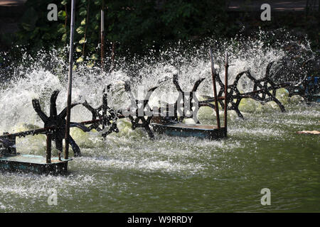 Oxygen generator is hitting the surface to create the bubbles for wastewater treatment. Stock Photo