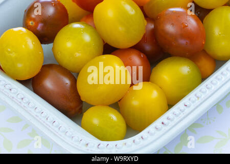several yellow and red cherry tomatoes Stock Photo