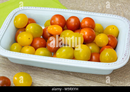 several yellow and red cherry tomatoes Stock Photo