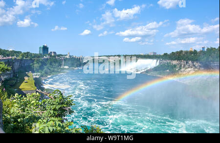 Beautiful Niagara Falls in summer on a clear sunny day with rainbow, view from Canadian side. Niagara Falls, Ontario, Canada Stock Photo