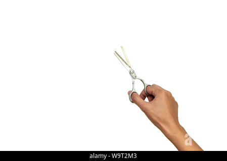 Hands holding pair of open stylish professional barber thinning scissors isolated on white background. Copy space. Top view. Flat lay Stock Photo