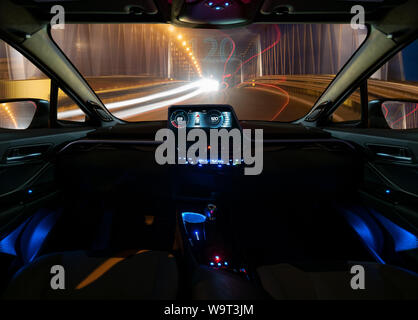 vision of an autonomous car driving at night in a lighted tunnel. Stock Photo