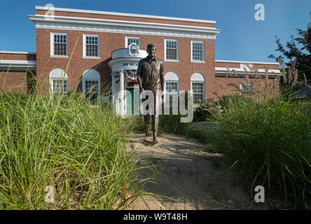 Life-sized bronze statue of John F. Kennedy (JFK) by sculptor David Lewis in front of the JFK Museum in Hyannis, Massachusetts. Stock Photo