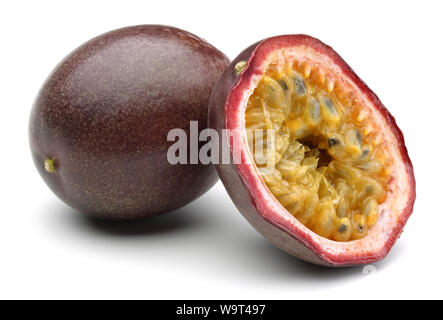 Whole and half passion fruits isolated on white background Stock Photo