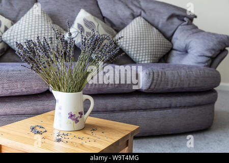 Dried lavender in a jug in a modern setting. Stock Photo