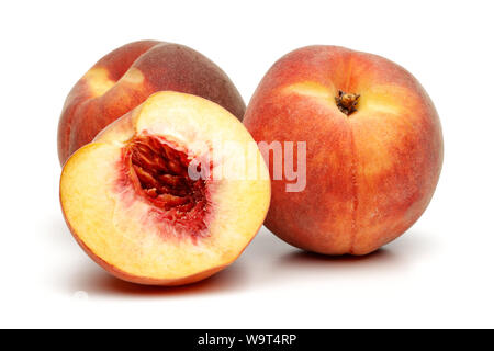 Whole and sliced peach fruits isolated on white background Stock Photo