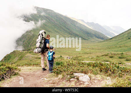 two travelers go to mountain camping Stock Photo