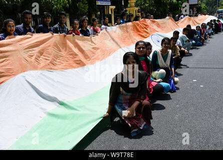 Guwahati, Assam, India. 15 August 2019. Cotton University students made a 50 miter long Indian National Flag as they walk in a rally in the occasion of Indian Independence day, Guwahati, Assam  on Aug 15, 2019. Photo: David Talukdar/ Alamy Live News Stock Photo