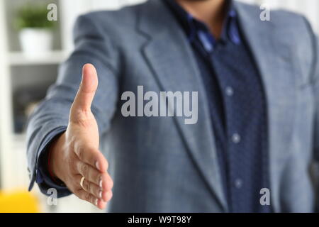 businessman work in office lend hand ahead closeup Stock Photo