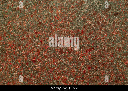Background, natural texture - the mottled surface of a red-gray granite slab Stock Photo