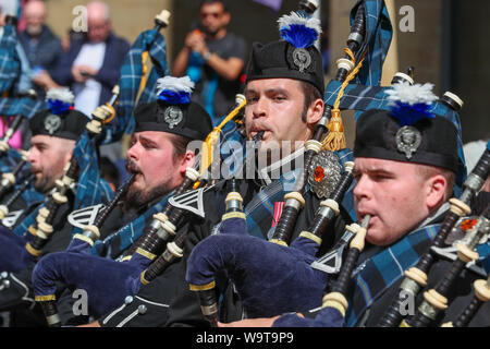 Glasgow, UK. 15 August 2019.  Piping Live, thought to be the biggest celebration of bagpipe music and pipe bands continues to attract large audiences and entertain with free performances in Buchanan Street in Glasgow's City Centre from international pipe bands. Pipers from Pipers Trail Band - a collective from the Royal Edinburgh Military tattoo Credit: Findlay/Alamy Live News Stock Photo