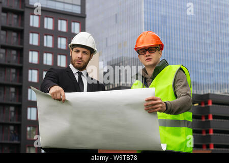 engineer and builder  explaining drawing  architect plan  professional Stock Photo