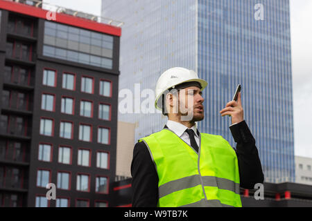 builder engineer talking on the phone businessman serious worker Stock Photo