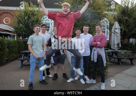 Kingston Grammar School students jump for joy as they receive their A Level Results. Stock Photo