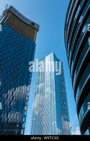 Two of the four Deansgate Square apartment blocks under construction (Aug 2019).  Manchester, England, UK. Stock Photo