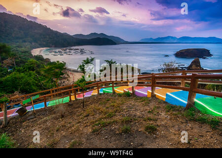 Multi-colored steps leading down to Papuma Beach, Jember, Indonesia Stock Photo