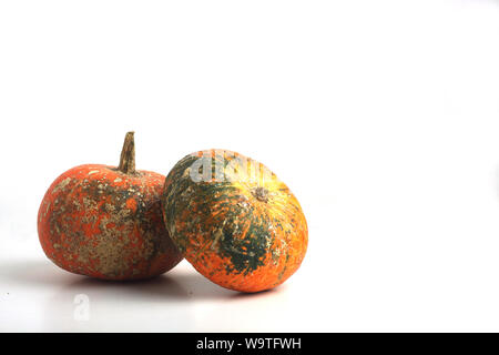 a pile of two pumpkins isolated on white background Stock Photo - Alamy