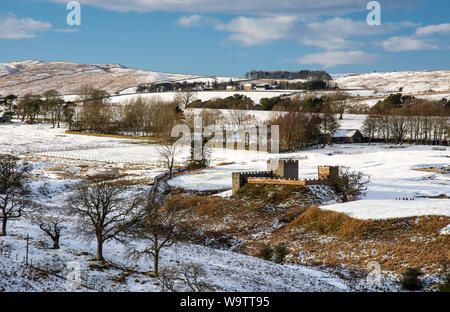 Snow lies on the Roman Vindolanda fort near the route of Hadrian's Wall in the hills of Northumberland. Stock Photo