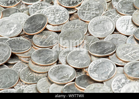 A Background of United States Dime Coins Close up Stock Photo