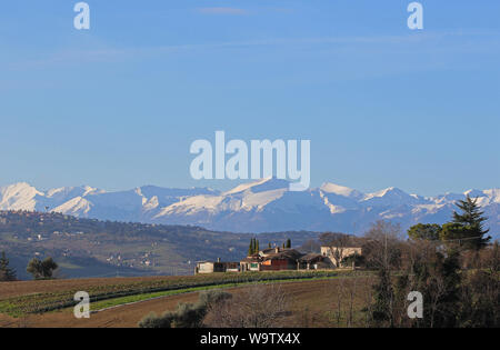 The Sibillini mountains part of the range of the Apennines seen from Montecassiano in Le Marche, Italy monti sibillini or sibilline mountains Stock Photo