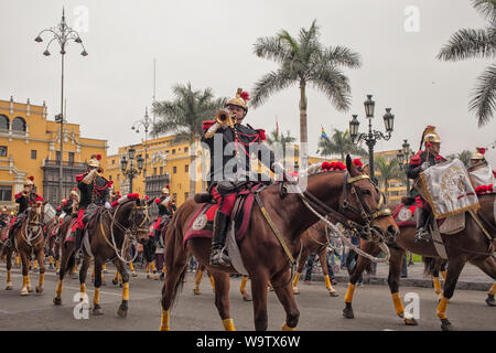 Mounted police buglers are part of the daily changing of the guard at the Palacio de Gobierno in the historic center of Lima, Pru Stock Photo