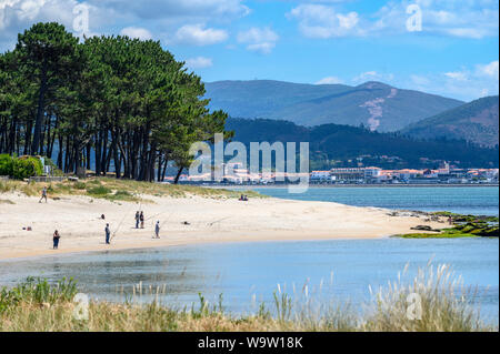 Camposancos beach on the Estuary of The River Mino dividing Spain from Portugal with the portuguese town of Caminha in the background.  A Guarda in Po Stock Photo