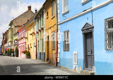The pretty, coloured houses on Str Cetatii, in Sibiu's old town, in Transylvania, Romania Stock Photo