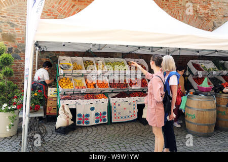 Fruit stall on gastronomy food market on historic Str Cetatii, in the old town of Sibiu, in Transylvania, Romania Stock Photo