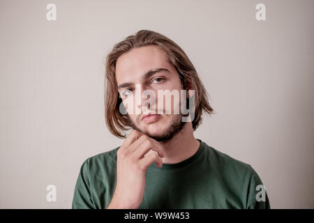 Portrait of confident young man or guy thinking, guy think with looking at camera Stock Photo