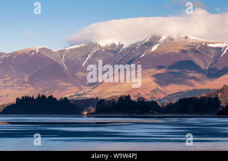 Low cloud shrouds the summit of Skiddaw mountain above Derwent Water in England's Lake District. Stock Photo