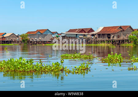 The colourful stilt houses in the floating village of Kompong Khleang by the Tonle Sap lake, Siem Reap, Angkor region, Cambodia. Stock Photo