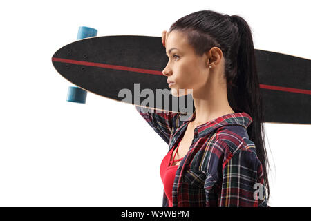 Close up profile shot of a young female carrying a longboard on shoulder isolated on white background Stock Photo